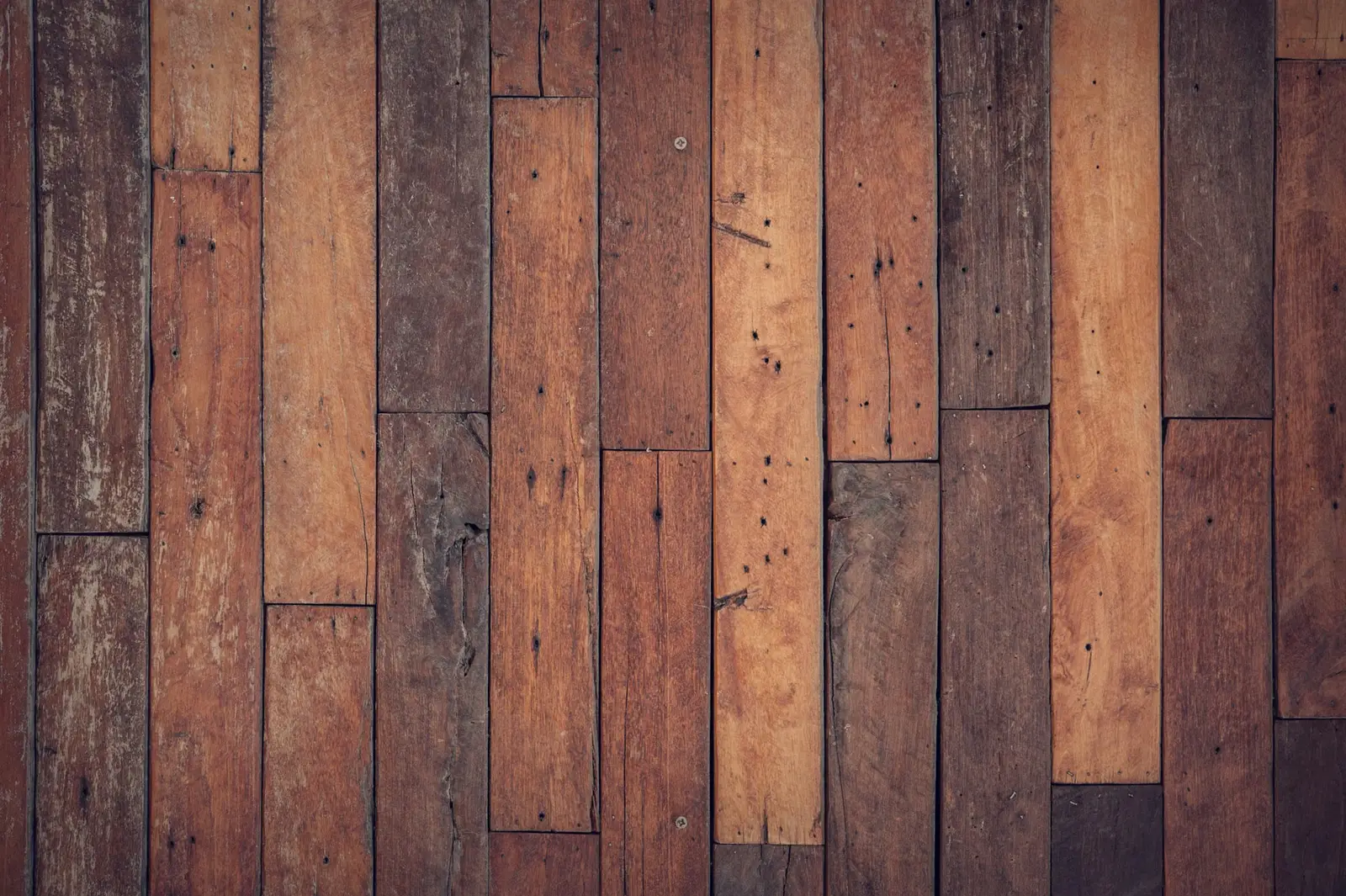 Close view of vertical wood planks in several brown tones